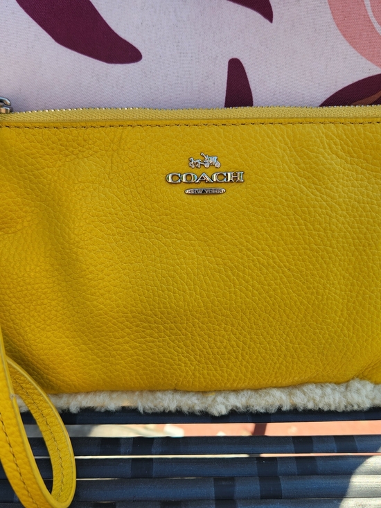 Coach Handbags - Coach Yellow Leather Shearling Trimmed Wristlet Clutch NWOT